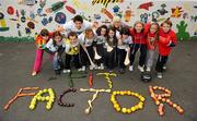 14 October 2010; Leinster star Kevin McLaughlin and RTE's Sinead Kennedy show children from Rathgar National School how to get the Fit Factor! Rathgar N.S., Rathgar, Dublin. Picture credit: Stephen McCarthy / SPORTSFILE