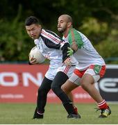 9 August 2016; Haoyuan Shi of Beijing in action against Ahmed Brumey of Oman GAA during the Etihad Airways GAA World Games 2016 - Day 1 at UCD in Dublin. Photo by Sam Barnes/Sportsfile