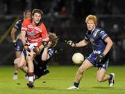 20 October 2010; Hugh Curran, Third Level Colleges, in action against Liam Picken and Todd Banfield, Australia. International Rules Warm-Up Match, Third Level Colleges v Australia, Pairc Ui Chaoimh, Cork. Picture credit: Matt Browne / SPORTSFILE