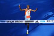 25 October 2010; Moses Kibet, Kenya, celebrates winning the Lifestyle Sports - adidas Dublin Marathon 2010, in a record time of 2 hours 8 minutes and 56 seconds. Dublin. Picture credit: Stephen McCarthy / SPORTSFILE