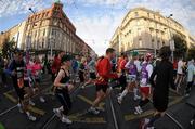 25 October 2010; Competitors cross the Luas lines as they make their way down O'Connell Street during the Lifestyle Sports - adidas Dublin Marathon 2010. Picture credit: Barry Cregg / SPORTSFILE