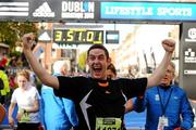 25 October 2010; Conor Galvin, from Dublin, celebrates after finishing the Lifestyle Sports - adidas Dublin Marathon 2010. Dublin. Picture credit: Stephen McCarthy / SPORTSFILE