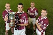 4 November 2010; 'Club is family’; Pictured at Castletown Liam Mellows GAA clubhouse are club members Andrew Merrigan with the cup and brothers, from left, Noel, Kevin and Colm Morris as preparations continue for their upcoming AIB Leinster GAA Football Senior Quarter-Final Club Championship fixture against Meath side Skryne on Sunday the 7th November. Andrew Merrigan is the nephew of deceased club man Andy Merrigan whom the AIB GAA All-Ireland Football Senior Club Championship Cup is named after. Castletown Liam Mellows GAA Clubhouse, Castletown, Wexford. Picture credit: Matt Browne / SPORTSFILE