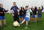 3 November 2010; Ulster Bank GAA star and Kerry footballer Darran O’Sullivan, with Conor Coleman, age 11, from Drogheda, and his Wolfe Tones GAA Club team-mates, during an Ulster Bank GAA coaching session. Wolfe Tones GAA Club, Drogheda, Co. Louth. Picture credit: Brian Lawless / SPORTSFILE