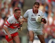 26 August 2001; Galway goalkeeper Alan Keane is tackled by Patrick Bradley of Derry during the Bank of Ireland All-Ireland Senior Football Championship Semi-Final match between Galway and Derry at Croke Park in Dublin. Photo by Brendan Moran/Sportsfile