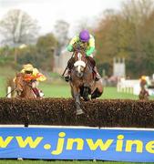 6 November 2010; Kauto Star, with Ruby Walsh up, go over the final fence on their way to winning the JNwine.com Champion Steeplechase. Down Royal Racecourse, Lisburn, Co. Down. Picture credit: Oliver McVeigh / SPORTSFILE