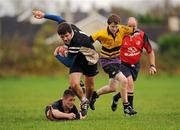 8 November 2010; Tadgh Foley, Ard Scoil na Trionoide, is tackled by Conor Gilsenan, left, and Frank Chambers, St. Pauls. Duff Cup 1st Round, Ard Scoil na Trionoide v St. Pauls, Newbridge College, Newbridge, Co. Kildare. Picture credit: Barry Cregg / SPORTSFILE