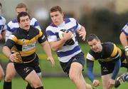 13 November 2010; Andrew Conway, Blackrock College, gets away from Ger Slattery, left, and Alan Kingsley, Young Munster. All-Ireland League, Young Munster v Blackrock College, Tom Clifford Park, Limerick. Picture credit: Diarmuid Greene / SPORTSFILE