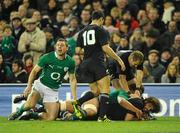 20 November 2010; Sam Whitlock, New Zealand, goes over to score his side's third try despite the tackle of Donncha O'Callaghan, Ireland. Autumn International, Ireland v New Zealand, Aviva Stadium, Lansdowne Road, Dublin. Picture credit: Stephen McCarthy / SPORTSFILE