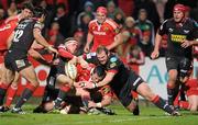 21 November 2010; James Coiughlan, Munster, loses possession just short of the try line while being tackled by Rhys Priestland, left, and Peter Edwards, Llanelli Scarlets. Celtic League, Munster v Llanelli Scarlets, Musgrave Park, Cork. Picture credit: Brendan Moran / SPORTSFILE