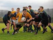 22 November 2010; Rian Pearse, CBS Naas, breaks away from the pack despite the attempts of Stephen O'Boyle, left, and Robbie Bradshaw, right, East Glendalough, to score a try. Duff Cup Semi-Final, CBS Naas v East Glendalough, Old Wesley RFC, Kiltiernan, Co. Dublin. Picture credit: Barry Cregg / SPORTSFILE