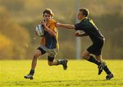 22 November 2010; Callum Fitzsimons, CBS Naas, is tackled by Luke Daunt Smith, East Glendalough. Duff Cup Semi-Final, CBS Naas v East Glendalough, Old Wesley RFC, Kiltiernan, Co. Dublin. Picture credit: Barry Cregg / SPORTSFILE