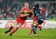 4 December 2010; Paul O'Connell, Munster, is tackled by Ma'ama Molitika, Cardiff Blues. Celtic League, Munster v Cardiff Blues, Thomond Park, Limerick. Picture credit: Brendan Moran / SPORTSFILE