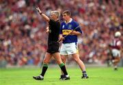 9 September 2001; Referee Pat O'Connor signals for assistance for John Carroll of Tipperary after he received a blood injury during the Guinness All-Ireland Senior Hurling Championship Final match between Tipperary and Galway at Croke Park in Dublin. Photo by Ray McManus/Sportsfile