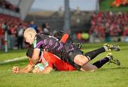 12 December 2010; Doug Howlett, Munster, scores his side's first try despite the efforts of Richard Fussell, Ospreys. Heineken Cup Pool 3 - Round 3, Munster v Ospreys, Thomond Park, Limerick. Picture credit: Diarmuid Greene / SPORTSFILE