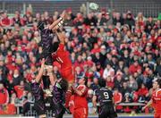 12 December 2010; Jonathan Thomas, Ospreys, takes the ball in the lineout against Donncha O'Callaghan, Munster. Heineken Cup Pool 3 - Round 3, Munster v Ospreys, Thomond Park, Limerick. Picture credit: Matt Browne / SPORTSFILE