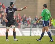 12 December 2010; Jonathan Thomas, Ospreys, speaks to referee Christophe Berdos after an incident with Munster's Paul O'Connell. Heineken Cup Pool 3 - Round 3, Munster v Ospreys, Thomond Park, Limerick. Picture credit: Diarmuid Greene / SPORTSFILE