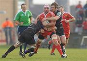 12 December 2010; Denis Leamy, Munster, is tackled by Marty Holah, left, and Andrew Bishop, Ospreys. Heineken Cup Pool 3 - Round 3, Munster v Ospreys, Thomond Park, Limerick. Picture credit: Diarmuid Greene / SPORTSFILE