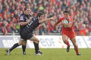 12 December 2010; Doug Howlett, Munster, gets away from Andrew Bishop, Ospreys. Heineken Cup Pool 3 - Round 3, Munster v Ospreys, Thomond Park, Limerick. Picture credit: Diarmuid Greene / SPORTSFILE