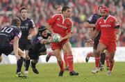 12 December 2010; Doug Howlett, Munster, is tackled by Marty Holah, Ospreys. Heineken Cup Pool 3 - Round 3, Munster v Ospreys, Thomond Park, Limerick. Picture credit: Diarmuid Greene / SPORTSFILE