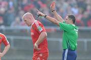 12 December 2010; Munster's Paul O'Connell is shown the red card by referee Christophe Berdos. Heineken Cup Pool 3 - Round 3, Munster v Ospreys, Thomond Park, Limerick. Picture credit: Matt Browne / SPORTSFILE