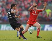 12 December 2010; James Hook, Ospreys, kicks upfield despite the efforts of Ronan O'Gara, Munster. Heineken Cup Pool 3 - Round 3, Munster v Ospreys, Thomond Park, Limerick. Picture credit: Diarmuid Greene / SPORTSFILE