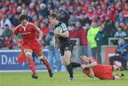 12 December 2010; Tommy Bowe, Ospreys, is tackled by Keith Earls and Donncha O'Callaghan, left, Munster. Heineken Cup Pool 3 - Round 3, Munster v Ospreys, Thomond Park, Limerick. Picture credit: Matt Browne / SPORTSFILE