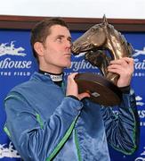 15 December 2010; Jockey Andrew McNamara with the John Durkan Memorial trophy after winning The John Durkan Memorial Punchestown Steeplechase on Tranquil Sea. Fairyhouse Racecourse, Fairyhouse, Co. Meath. Picture credit: Barry Cregg / SPORTSFILE