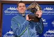 15 December 2010; Jockey Andrew McNamara with the John Durkan Memorial trophy after winning The John Durkan Memorial Punchestown Steeplechase on Tranquil Sea. Fairyhouse Racecourse, Fairyhouse, Co. Meath. Picture credit: Barry Cregg / SPORTSFILE