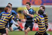 15 December 2010; Sam Crowe, Newpark Comprehensive, in action against Philip Tucker, left, and Eoghan Fox, Skerries C.C. McMullen Cup Final, Skerries C.C. v Newpark Comprehensive, Donnybrook, Dublin. Picture credit: David Maher / SPORTSFILE