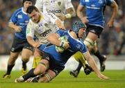 18 December 2010; Sean O'Brien, Leinster, is tackled by Thomas Domingo, ASM Clermont Auvergne. Heineken Cup, Pool 2, Round 4, Leinster v ASM Clermont Auvergne, Aviva Stadium, Lansdowne Road, Dublin. Picture credit: Brendan Moran / SPORTSFILE