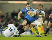 18 December 2010; Sean O'Brien, Leinster, is tackled by Sione Lauaki and Brock James, left, ASM Clermont Auvergne. Heineken Cup, Pool 2, Round 4, Leinster v ASM Clermont Auvergne, Aviva Stadium, Lansdowne Road, Dublin. Picture credit: Brendan Moran / SPORTSFILE