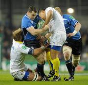 18 December 2010; Cian Healy, Leinster, is tackled by Thibaut Privat, left, and Ti'i Paulo, ASM Clermont Auvergne. Heineken Cup, Pool 2, Round 4, Leinster v ASM Clermont Auvergne, Aviva Stadium, Lansdowne Road, Dublin. Picture credit: Brendan Moran / SPORTSFILE