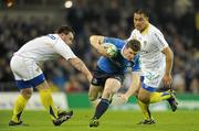 18 December 2010; Brian O'Driscoll, Leinster, in action against Thomas Domingo, left, and Ti'i Paulo, ASM Clermont Auvergne. Heineken Cup, Pool 2, Round 4, Leinster v ASM Clermont Auvergne, Aviva Stadium, Lansdowne Road, Dublin. Picture credit: Brendan Moran / SPORTSFILE