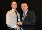 19 December 2010; Dublin's Eoin Culligan is presented with his All-Ireland U-21 medal by Uachtarán CLG Criostóir Ó Cuana. The Officers Mess, Baldonnell, Dublin. Picture credit: Barry Cregg / SPORTSFILE