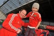 6 January 2011; Munster head coach Tony McGahan with Tom O'Brien, aged 5, from Caherdavin, Limerick, after squad training ahead of their Celtic League game against Glasgow Warriors on Saturday. Munster Squad Open Training Session, Thomond Park, Limerick. Picture credit: Diarmuid Greene / SPORTSFILE