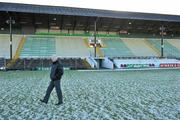 9 January 2011; Dessie Murtagh, Assistant Treasurer of the Meath County Board, walks the pitch after the game was postponed due to a frozen pitch. O'Byrne Cup, Meath v UCD, Pairc Tailteann, Navan, Co. Meath. Picture credit: Brendan Moran / SPORTSFILE