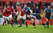 9 September 2016; Darren Sweetnam of Munster gets away from the challenge of Gareth Anscombe of Cardiff Blues during the Guinness PRO12 Round 2 match between Munster and Cardiff Blues at Irish Independent Park in Cork. Photo by Piaras Ó Mídheach/Sportsfile