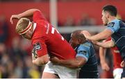 9 September 2016; John Ryan of Munster is tackled by Taufa'ao Filise of Cardiff Blues, supported by team-mate Tomos Williams, right, during the Guinness PRO12 Round 2 match between Munster and Cardiff Blues at Irish Independent Park in Cork. Photo by Piaras Ó Mídheach/Sportsfile
