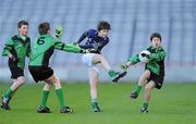 11 January 2011; Simon King, centre, St. Pius X BNS shot is blocked by Conor Doyle, right, St. Josephs BNS with support from Michael Varley, left, and Gavin Brady. Allianz Cumann na mBunscol Football Finals, Corn na nGearaltach, St. Pius X BNS, Terenure v St. Josephs BNS, Terenure. Croke Park, Dublin. Picture credit: Barry Cregg / SPORTSFILE