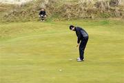 13 January 2011; Padraig Harrington watches his putt on the 8th green during the Links Golf Society - Waterford Crystal outing. Portmarnock Hotel and Golf Links, Portmarnock, Dublin. Picture credit: Matt Browne / SPORTSFILE