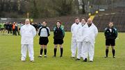 15 January 2011; Match referee Gregory walsh, Antrim, second from left, and his match officials observe a minute's silence for the late Michaela McAreavey. Barrett Sports Lighting Dr. McKenna Cup, Section B, Monaghan v QUB, St Tiernach's Park, Clones, Co. Monaghan. Picture credit: Ray McManus / SPORTSFILE