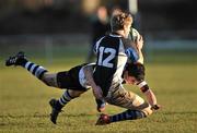 19 January 2011; David Sharkey O'Keeffe, Mount Temple, is tackled by Peter Osborne, Newbridge College. Powerade Leinster Schools Rugby Vinnie Murray Cup, 1st Round, Mount Temple v Newbridge College, Barnhall RFC, Parsonstown, Leixlip, Co. Kildare. Picture credit: David Maher / SPORTSFILE