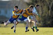 20 January 2011; Rhys Clarke, St. Peter’s Wexford, in action against Jack Donohue, left, and Brian Shaughnessy, Athlone CC. Leinster Colleges Senior Football A Championship, Round 2, St. Peter’s Wexford v Athlone CC, Carlow Hurling Club, Carlow. Picture credit: Matt Browne / SPORTSFILE