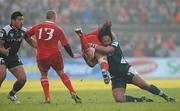 22 January 2011; Niall Ronan, Munster, is tackled by Seilala Mapusua, London Irish. Heineken Cup Pool 3, Round 6, Munster v London Irish, Thomond Park, Limerick. Picture credit: Diarmuid Greene / SPORTSFILE