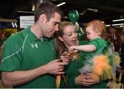 21 September 2016; Jason Smyth of Ireland shows his gold medal to his 10-month-old daughter Evie, alongside his wife Elise, all from Belfast, which he won in the Men's 100m T13 Final during their homecoming from the Rio 2016 Paralympic Games at Dublin Airport in Dublin. Photo by Cody Glenn/Sportsfile