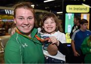 21 September 2016; Noelle Lenihan of Ireland, from Charleville, Co Cork, who won bronze in the f38 discus, with her neice Kendal Ming, age 4, who flew in from Arkansas, USA, during their homecoming from the Rio 2016 Paralympic Games at Dublin Airport in Dublin. Photo by Cody Glenn/Sportsfile