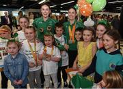 21 September 2016; Cyclists Eve McCrystal, left, and Katie-George Dunlevy, who won silver in the Women's B Road Race with family and young supporters during their homecoming from the Rio 2016 Paralympic Games at Dublin Airport in Dublin. Photo by Cody Glenn/Sportsfile