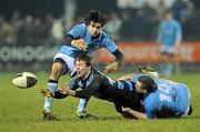 28 January 2011; Luke O'Dea, Shannon, is tackled by Alan Gaughan and Conor Murray, left, Garryowen. Ulster Bank All-Ireland League Division 1A, Garryowen v Shannon, Garryowen FC, Dooradoyle, Limerick. Picture credit: Diarmuid Greene / SPORTSFILE