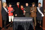 30 January 2011; Mark Noonan, Head of Marketing, Boylesports, presenting the trophy to the winning owners of Golden Silver Violet O'Leary and her husband Archie after winning the Boylesports.com Tied Cottage Steeplechase. Also pictured are trainer Willie Mullins, right, and jockey Paul Townend. Horse Racing, Punchestown Racecourse, Punchestown, Co. Kildare. Photo by Sportsfile